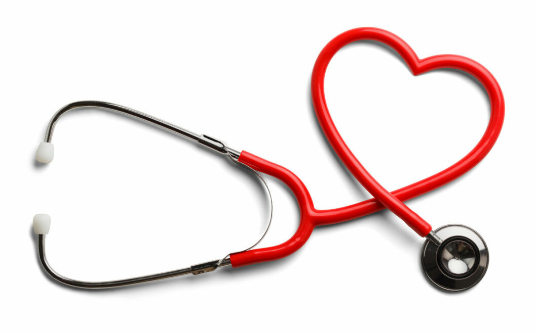 Red Stethoscope in Shape of Heart Isolated On White Background.