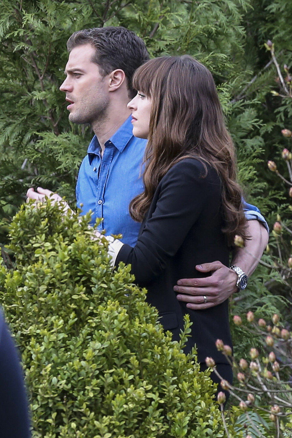 04/11/2016Dakota Johnson and Jamie Dornan spotted on The Set of Fifty Shades Darker looking quite like the couple. While frolicking through some shrubbery the two actors displayed their wedding bands through interlocking hands. Dakota was spotted in a black blazer and a low cut black skirt while co-star Jamie kept things casual in a blue button down oxford and dark blue jeans. Please byline:TheImageDirect.com IBL