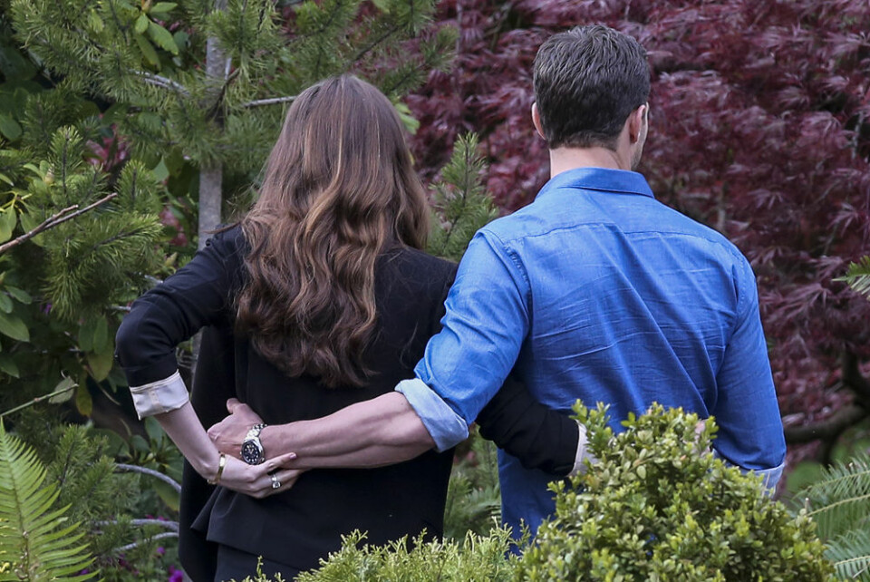 04/11/2016Dakota Johnson and Jamie Dornan spotted on The Set of Fifty Shades Darker looking quite like the couple. While frolicking through some shrubbery the two actors displayed their wedding bands through interlocking hands. Dakota was spotted in a black blazer and a low cut black skirt while co-star Jamie kept things casual in a blue button down oxford and dark blue jeans. Please byline:TheImageDirect.com IBL