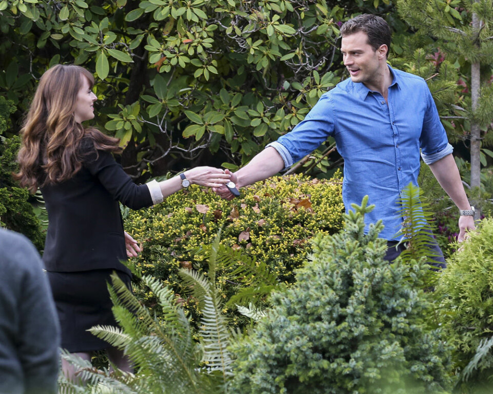 04/11/2016Dakota Johnson and Jamie Dornan spotted on The Set of Fifty Shades Darker looking quite like the couple. While frolicking through some shrubbery the two actors displayed their wedding bands through interlocking hands. Dakota was spotted in a black blazer and a low cut black skirt while co-star Jamie kept things casual in a blue button down oxford and dark blue jeans. Please byline:TheImageDirect.com IBL