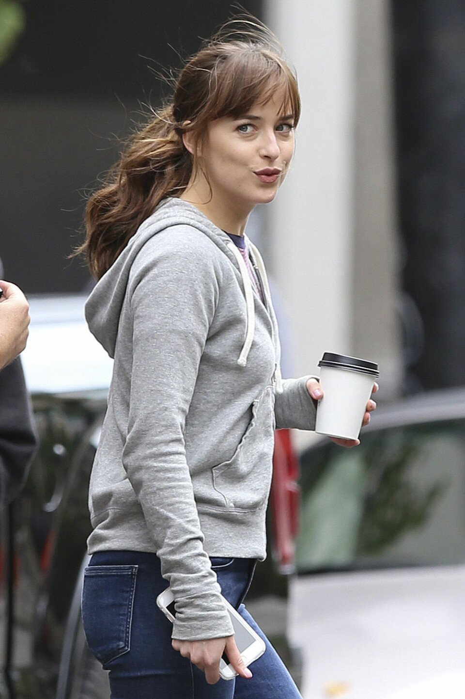 EXCLUSIVE: Dakota Johnson, in costume as Anastasia Steele, exits out of a sports-car and runs into 'Seattle Nations Bank' in order to get the ransom money! Dressed casually in jeans, converse shoes and a zip hoodie, Dakota had fun on set. Filming for Fifty Shades Freed is wrapping up in a couple weeks!Pictured: dakota johnsonRef: SPL1301410 140616 EXCLUSIVEPicture by: Splash NewsSplash News and PicturesLos Angeles:310-821-2666New York:212-619-2666London:870-934-2666photodesk@splashnews.com IBL