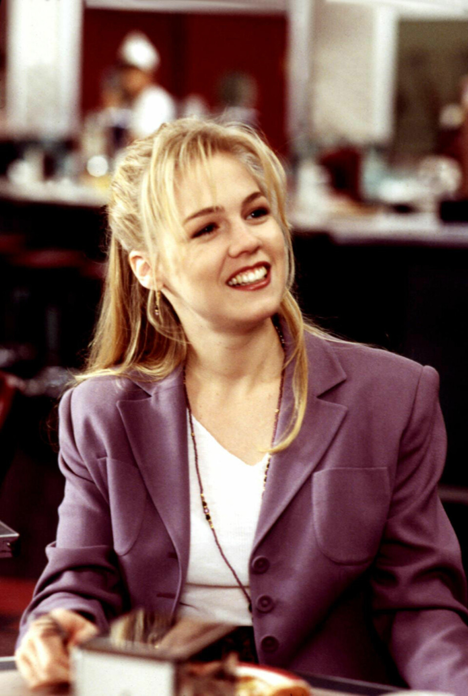 Ett av Kellys favoritplagg var kavaj. Här i en snygg lila färg.