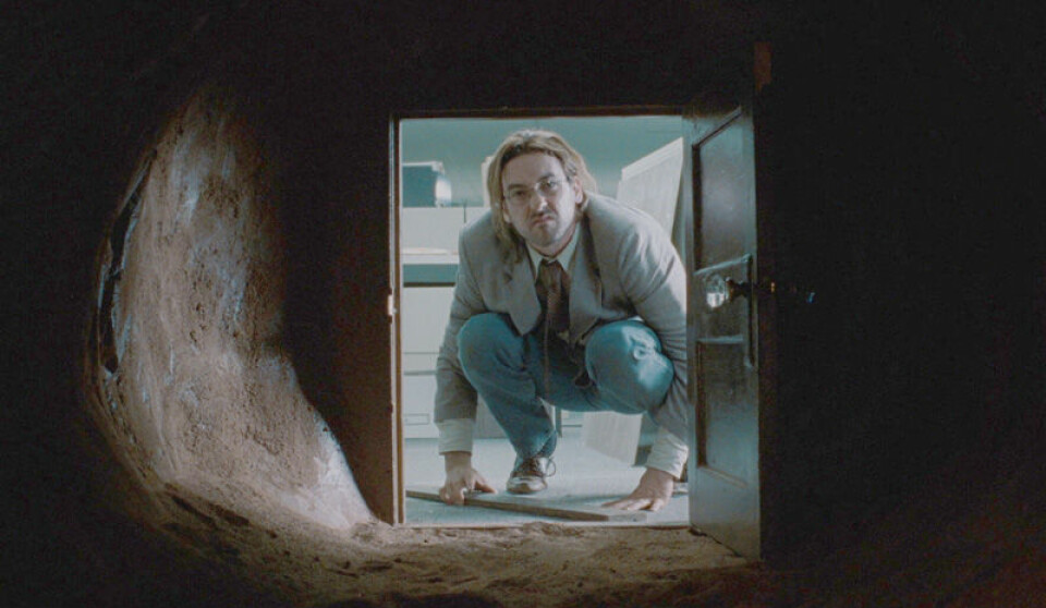 John Cusack hittar dörren som leder in till John Malkovich huvud. Foto: USA Films John Cusack hittar dörren som leder in till John Malkovich huvud. Foto: USA Films