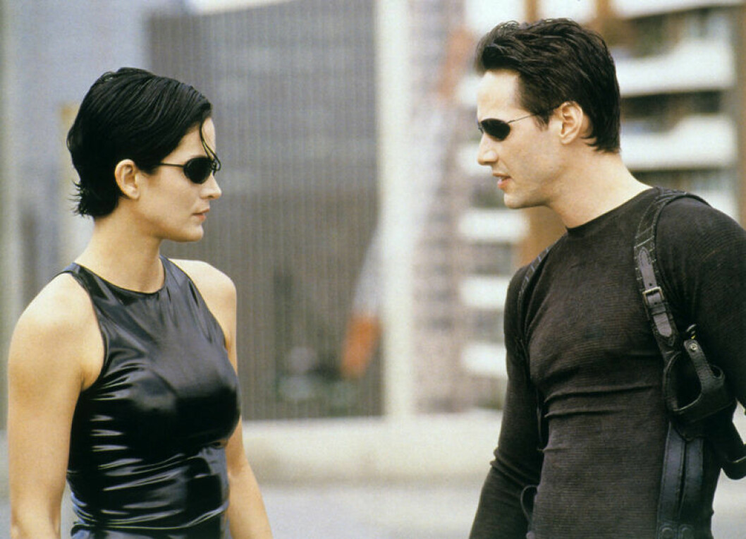 Carrie-Anne Moss och Keanu Reeves i The Matrix. Foto: TT Bild från The Matrix (1999)