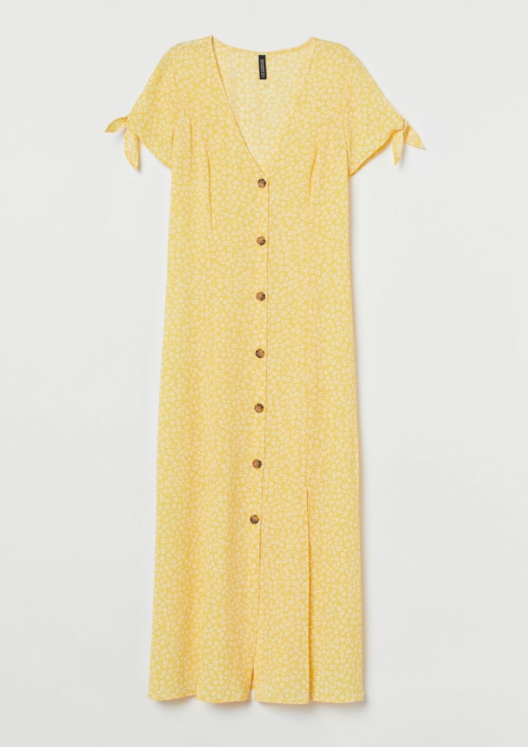 Mönstrad gul klänning med knappar från H&M till sommaren 2020